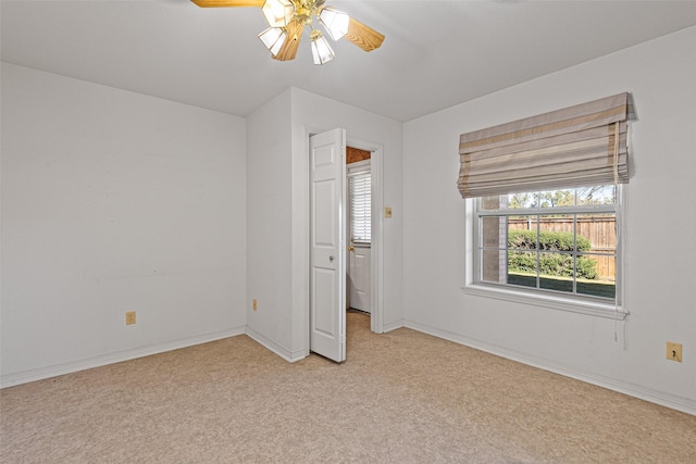 unfurnished bedroom featuring ceiling fan and light carpet