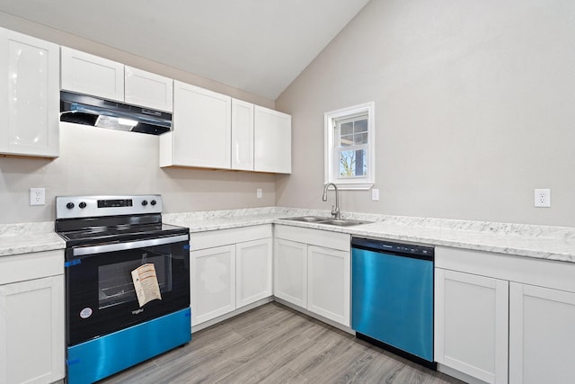 kitchen with white cabinets, lofted ceiling, sink, and appliances with stainless steel finishes