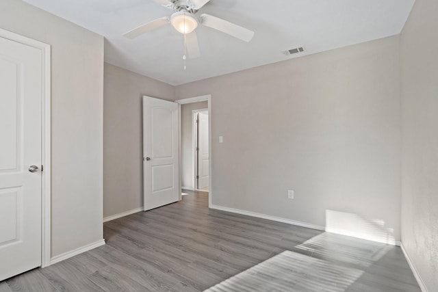 unfurnished bedroom with wood-type flooring and ceiling fan