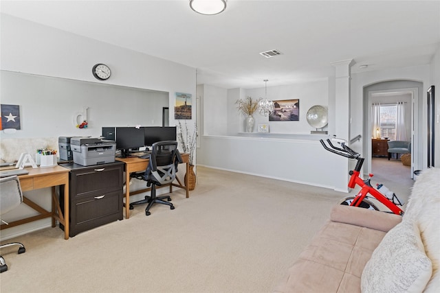 office space featuring light colored carpet and a chandelier