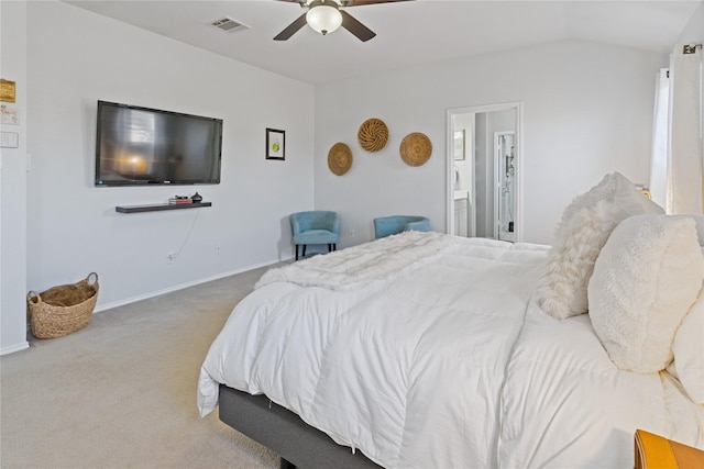 bedroom featuring carpet, ensuite bath, and ceiling fan