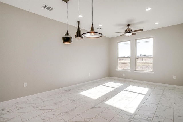 spare room with ceiling fan