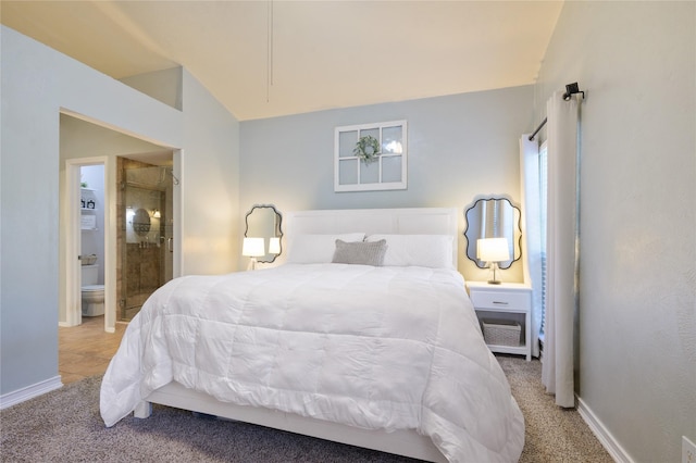 carpeted bedroom with lofted ceiling and ensuite bathroom