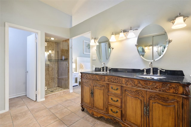 bathroom featuring tile patterned floors, walk in shower, and vanity