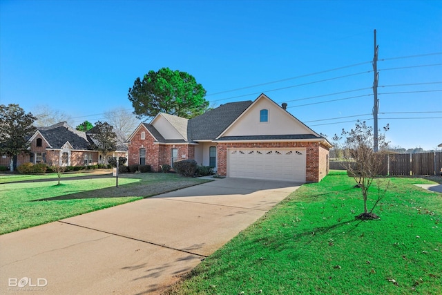 view of front of house featuring a garage and a front lawn