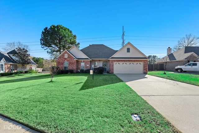 view of front of house with a garage and a front yard