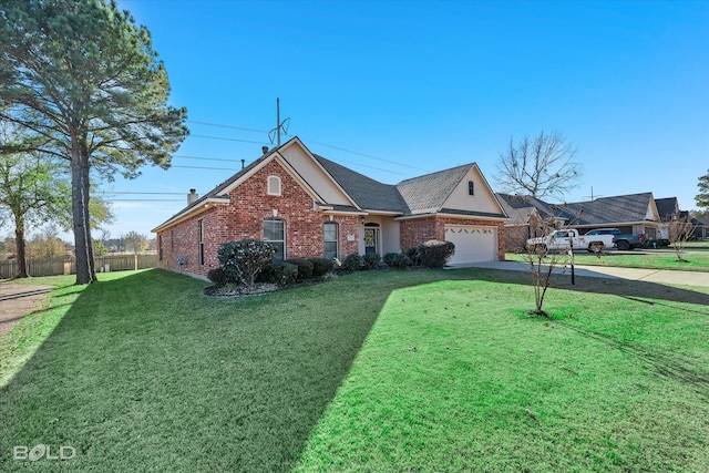 ranch-style home with a garage and a front yard