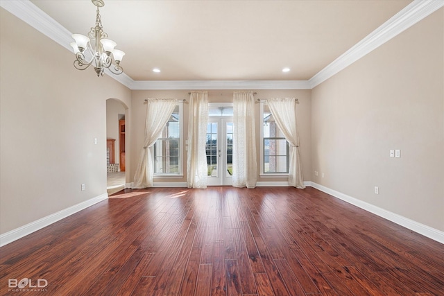 interior space with crown molding, plenty of natural light, and dark hardwood / wood-style floors