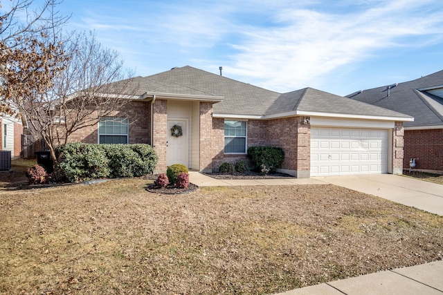 ranch-style home with a garage, a front lawn, and central AC unit