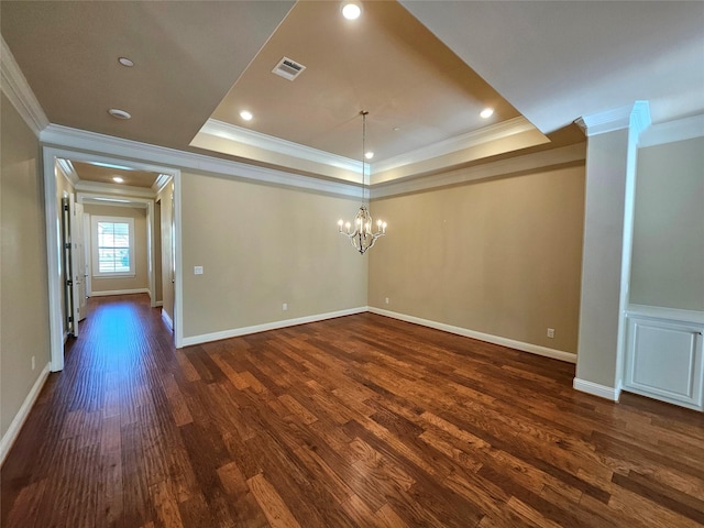 unfurnished room featuring a chandelier, ornamental molding, dark hardwood / wood-style floors, and a raised ceiling