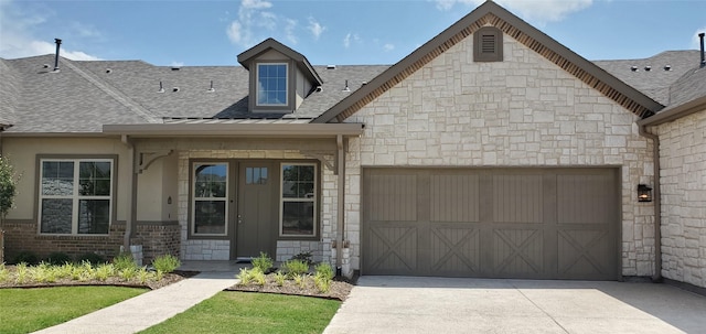 view of front of property with a garage