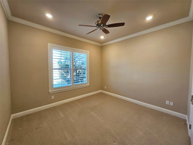 empty room with crown molding, ceiling fan, and carpet flooring