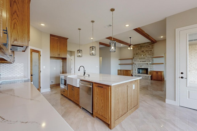 kitchen featuring a spacious island, sink, beam ceiling, pendant lighting, and dishwasher