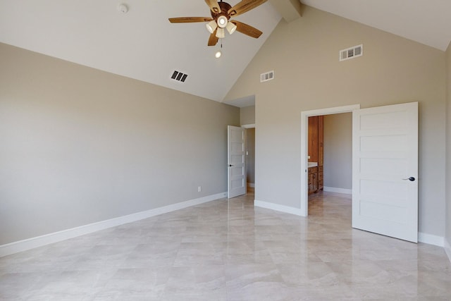 unfurnished bedroom with visible vents, high vaulted ceiling, and baseboards