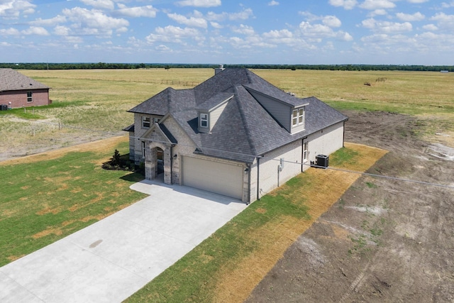 view of front of house featuring a rural view and a front yard