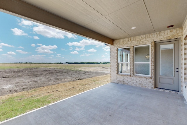 view of patio with a rural view