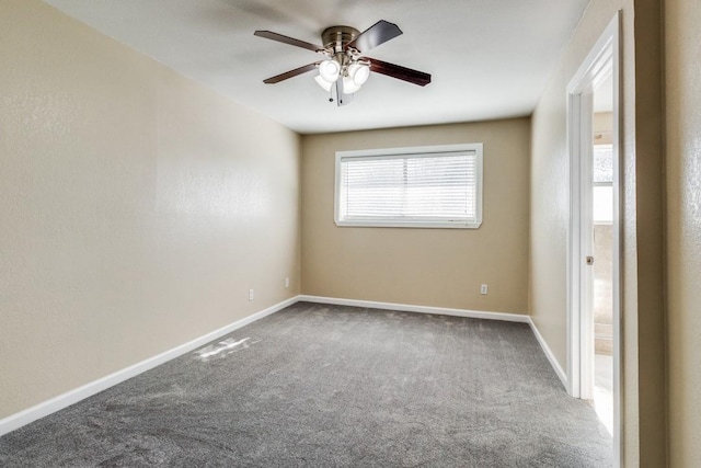 carpeted empty room with ceiling fan