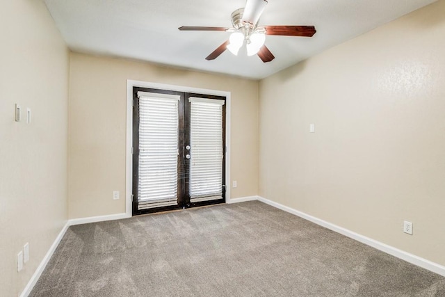 carpeted empty room with french doors and ceiling fan