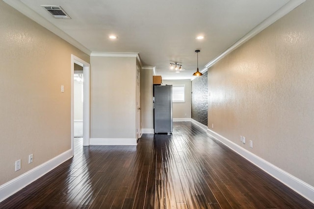 unfurnished room featuring dark hardwood / wood-style flooring and ornamental molding