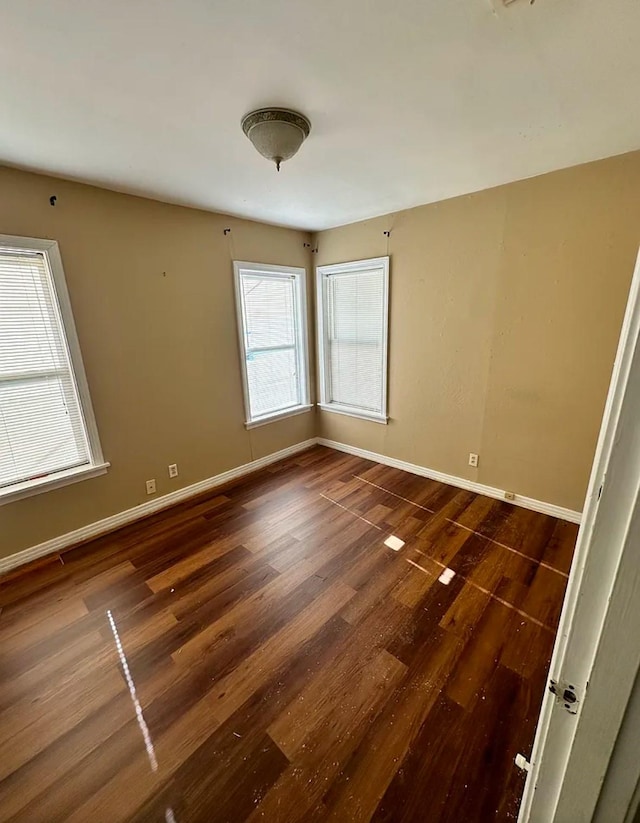 unfurnished room featuring dark hardwood / wood-style floors