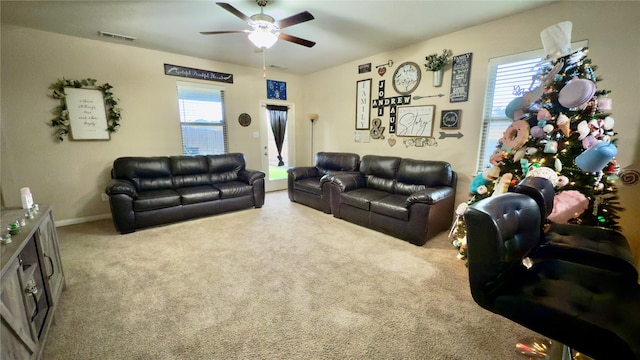 living room featuring carpet floors and ceiling fan