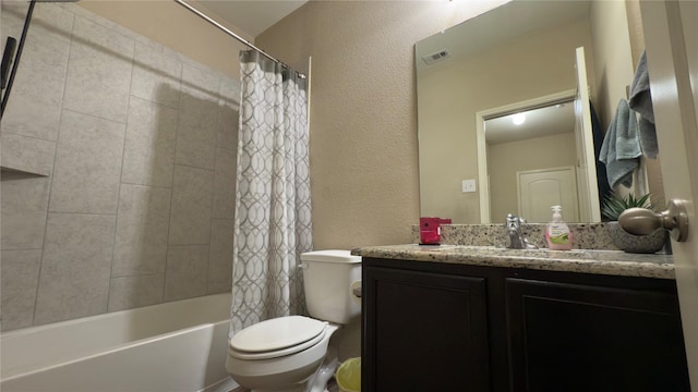 full bathroom featuring vanity, shower / bath combination with curtain, and toilet