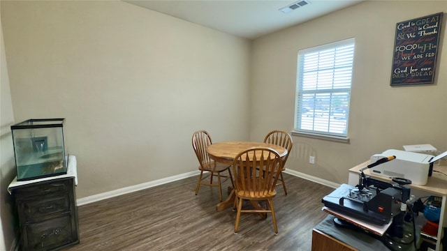 dining room with dark hardwood / wood-style floors