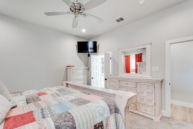 bedroom featuring ceiling fan and light colored carpet