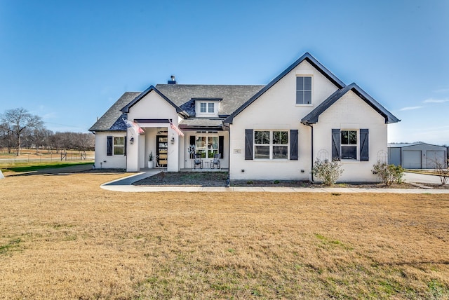 view of front of house with a front lawn and covered porch