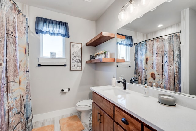 bathroom featuring tile patterned flooring, vanity, toilet, and a shower with curtain