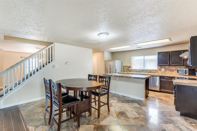 dining area featuring sink