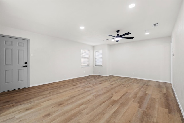 unfurnished room with ceiling fan and light hardwood / wood-style flooring