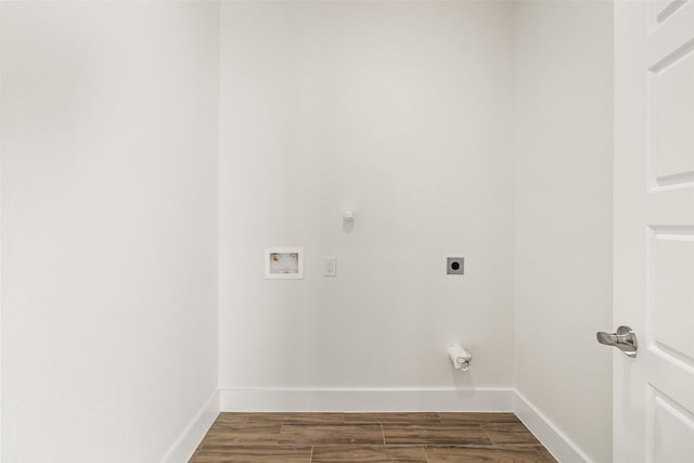 clothes washing area with electric dryer hookup, hookup for a gas dryer, dark wood-type flooring, and washer hookup