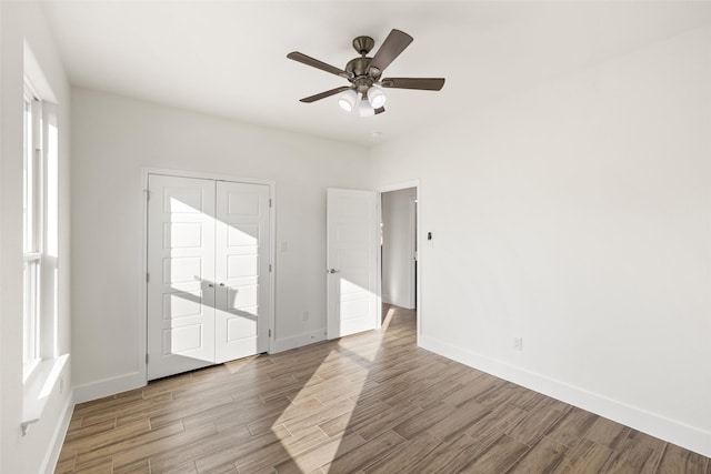 unfurnished room with ceiling fan