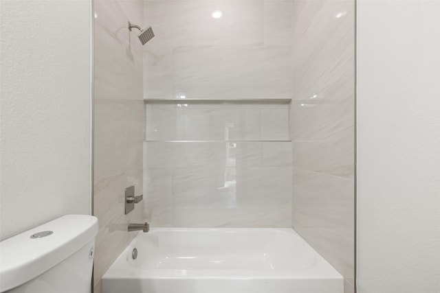 bathroom featuring  shower combination and toilet