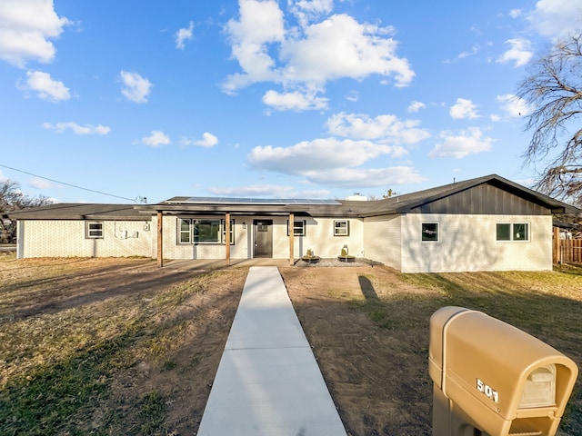 ranch-style house with a front lawn