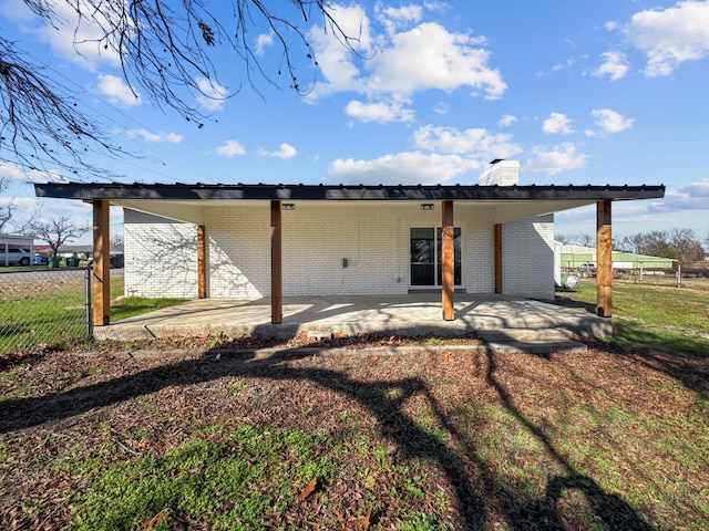 back of property featuring a patio area