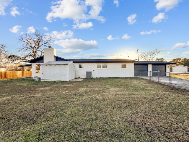 rear view of house with a lawn