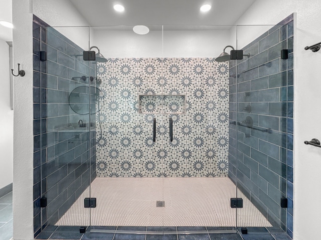 bathroom featuring tile patterned floors and an enclosed shower