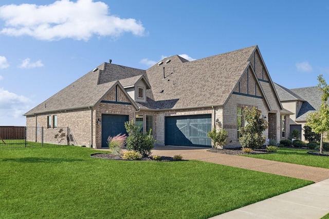 view of front of home with a garage and a front yard