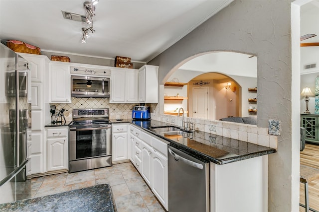 kitchen featuring white cabinetry, sink, and appliances with stainless steel finishes