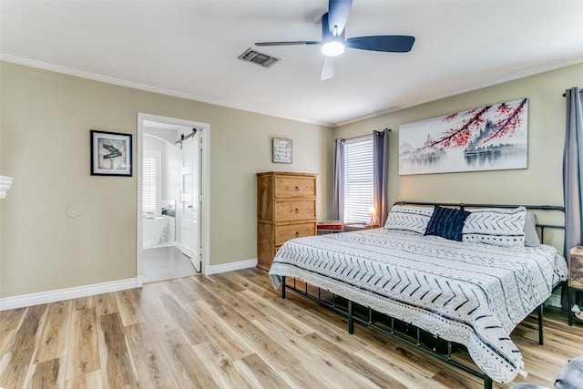 bedroom with connected bathroom, hardwood / wood-style floors, crown molding, and ceiling fan