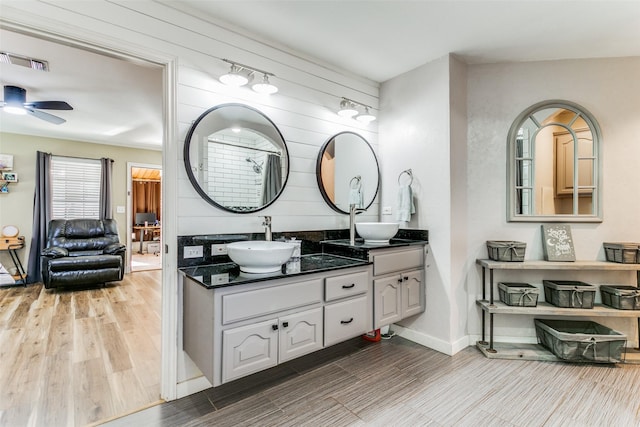 bathroom featuring vanity and ceiling fan