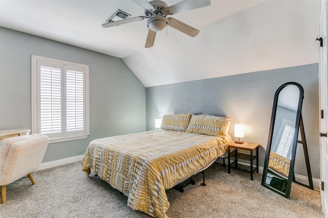 carpeted bedroom featuring ceiling fan and vaulted ceiling