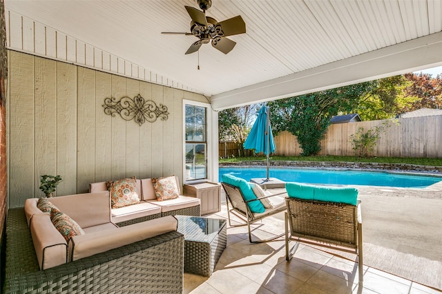 view of patio / terrace with ceiling fan, an outdoor living space, and a fenced in pool