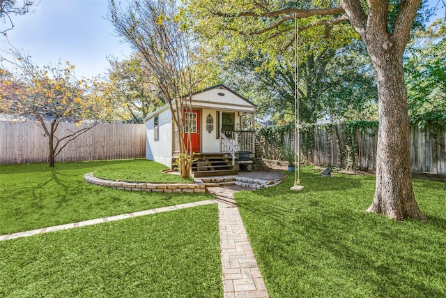 exterior space with an outdoor structure and a front yard