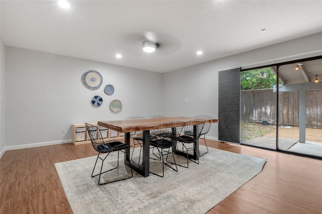 dining room featuring ceiling fan and light wood-type flooring