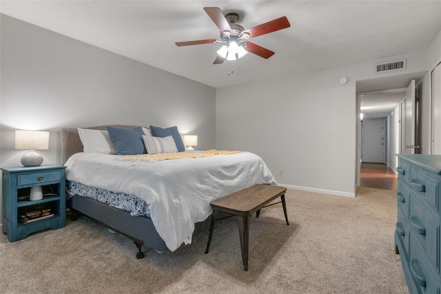 bedroom featuring ceiling fan and light carpet