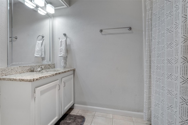 bathroom with vanity, tile patterned floors, and curtained shower