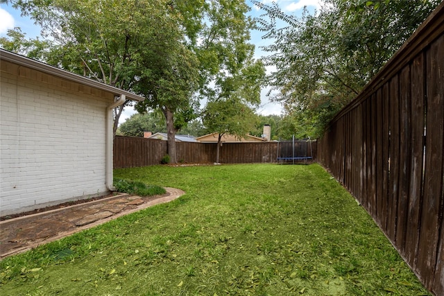 view of yard with a trampoline